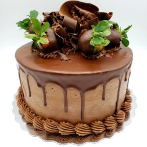 Chocolate Strawberry Venetian Truffle Cake (chocolate cake, fresh berries & chocolate cream filling, chocolate buttercream icing, hazelnut fudge ganache, chocolate dipped berry garnish