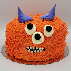 Max the Monster Cake (serves 6-8, vanilla cake, gooey caramel filling, buttercream icing)