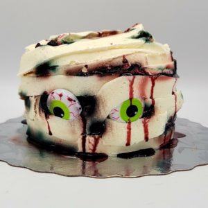 Halloween Mummy Cake (serves 4-6, vanilla cake, caramel filling, vanilla buttercream icing)